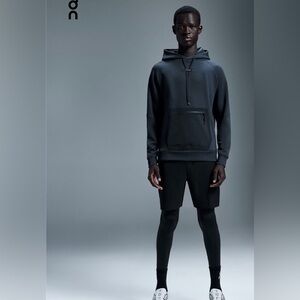 On cloud running Man’s hoodie.